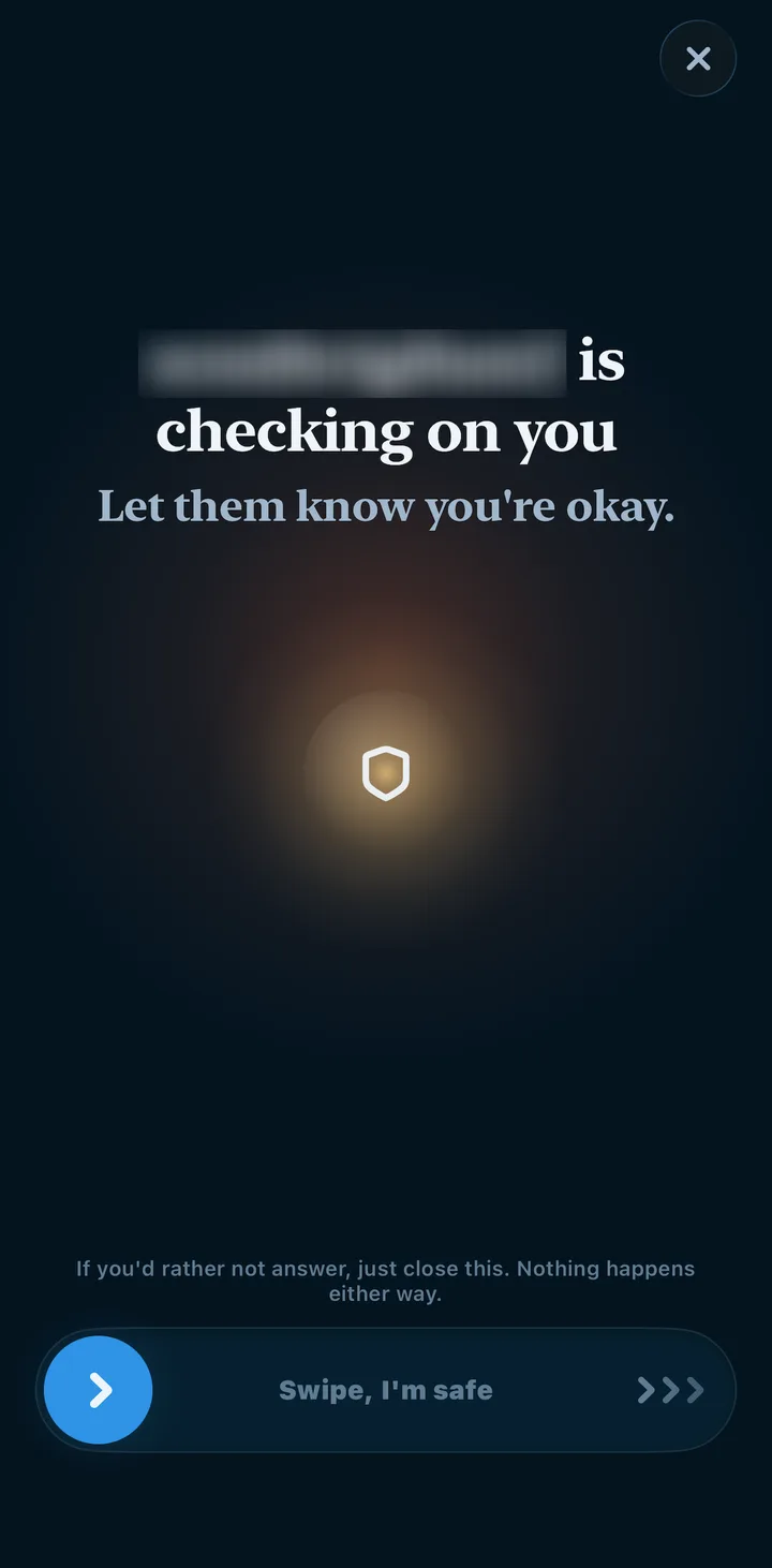 A VigilantHer check-in asking her to let a Circle member know she's okay, with a Swipe, I'm safe slider
